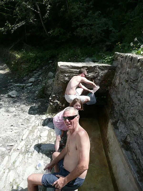 Topping up on water at a local spring