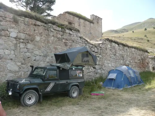 Camping in the Alps on an Overland travel trip