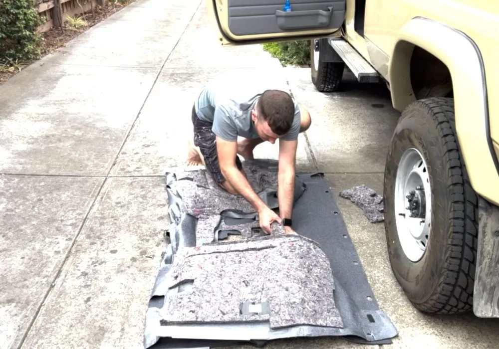 Removing stock sound absorption material from troopy carpets